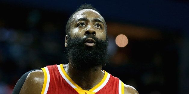CHARLOTTE, NC - APRIL 13: James Harden #13 of the Houston Rockets watches on against the Charlotte Hornets during their game at Time Warner Cable Arena on April 13, 2015 in Charlotte, North Carolina. NOTE TO USER: User expressly acknowledges and agrees that, by downloading and or using this photograph, User is consenting to the terms and conditions of the Getty Images License Agreement. (Photo by Streeter Lecka/Getty Images)
