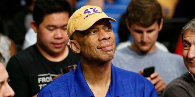 FILE - This April 1, 2014, file photo shows former Los Angeles Lakers player Kareem Abdul-Jabbar at an NBA basketball ball game in Los Angeles. Abdul-Jabbar is recovering after undergoing quadruple coronary bypass surgery. A hospital statement on Friday, April 17, 2015 says Abdul-Jabbar had the surgery on Thursday at Ronald Reagan UCLA Medical Center. The doctor who performed the surgery, says the 68-year-old former NBA and UCLA star is expected to make a full recovery.((AP Photo/Danny Moloshok,File)