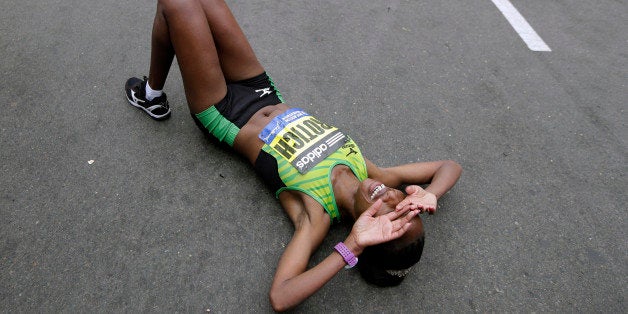 Caroline Rotich, of Kenya, reacts after winning the women's division of the Boston Marathon Monday, April 20, 2015 in Boston.