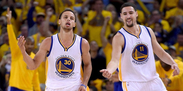 OAKLAND, CA - APRIL 20: Stephen Curry #30, and Klay Thompson #11 of the Golden State Warriors reacts after Curry hit a jump