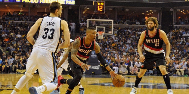 MEMPHIS, TN - APRIL 19: Damian Lillard #0 of the Portland Trailblazers plays against the Memphis Grizzlies during Game One of the first round of the 2015 NBA Playoffs at FedExForum on April 19, 2015 in Memphis, Tennessee. NOTE TO USER: User expressly acknowledges and agrees that, by downloading and/or using this photograph, user is consenting to the terms and conditions of the Getty Images License Agreement. (Photo by Frederick Breedon/Getty Images)