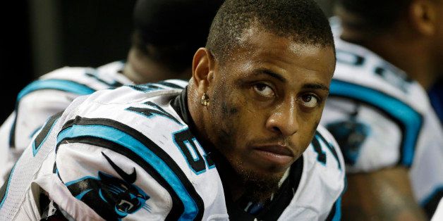 FILE - In this Dec. 29, 2013, file photo, Carolina Panthers defensive end Greg Hardy (76) sits on the bench during the second half of an NFL game against the Atlanta Falcons in Atlanta. The NFL is allowing two more NFL players to continue playing while facing domestic violence issues. Similar to the Ray Rice case, the league says it investigating and waiting for the legal process to run its course before taking action. Greg Hardy already has been convicted on two counts of domestic violence, but has filed an appeal. Ray McDonald of the San Francisco 49ers also remains active while he is being investigated for abuse allegations. (AP Photo/Dave Martin, File)