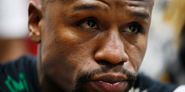 Boxer Floyd Mayweather Jr. gets taped up before a workout Tuesday, April 14, 2015, in Las Vegas. Mayweather will face Manny P