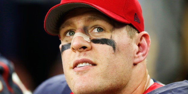 HOUSTON, TX - DECEMBER 28: J.J. Watt #99 of the Houston Texans sits on the bench late in their game against the Jacksonville Jaguars at NRG Stadium on December 28, 2014 in Houston, Texas. (Photo by Scott Halleran/Getty Images)