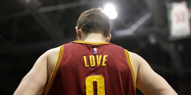 Cleveland Cavaliers' Kevin Love waits to pass the ball in during an NBA basketball game against the Milwaukee Bucks Sunday, M