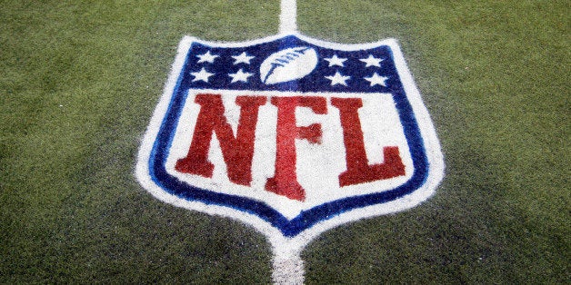 FILE - In this Nov. 20, 2011, file photo, an NFL logo is displayed on the Ford Field turf before an NFL football game between the Detroit Lions and the Carolina Panthers in Detroit. Google has been holding talks with the National Football League, raising speculation that the internet monolith is seeking new inroads into television. With Google sitting on a cash pile of $48 billion, the league's Sunday Ticket package is easily within its budget. The contract is currently held by DirecTV, but it expires at the end of the 2014 season. (AP Photo/Carlos Osorio, File)