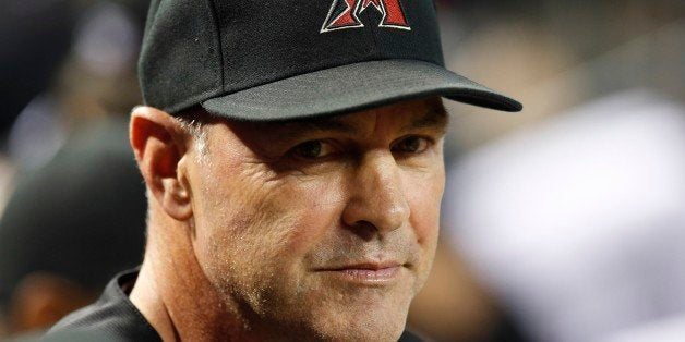 Arizona Diamondbacks' Kirk Gibson waits in the dugout prior to a baseball game against the Pittsburgh Pirates on Saturday, Au