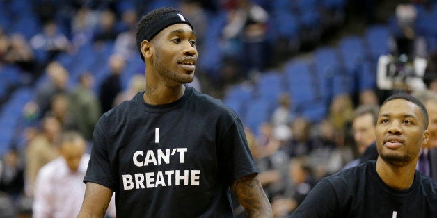 Portland Trail Blazers guard Will Barton, left, and guard Damian Lillard, right, wear "I Can't Breathe" shirts before an NBA basketball game against the Minnesota Timberwolves in Minneapolis, Wednesday, Dec. 10, 2014. (AP Photo/Ann Heisenfelt)