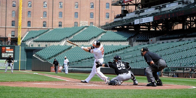 BALTIMORE, MD - APRIL 29: Chris Davis #19 of the Baltimore Orioles hits a three-run home run in the first inning against the Chicago White Sox at Oriole Park at Camden Yards on April 29, 2015 in Baltimore, Maryland. The game was played without spectators due to the social unrest in Baltimore. (Photo by Greg Fiume/Getty Images)