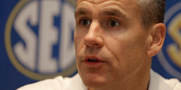 Florida head coach Billy Donovan answers a question during a news conference at the Southeastern Conference men's NCAA college basketball media day in Charlotte, N.C., Wednesday, Oct. 22, 2014. (AP Photo/Chuck Burton)
