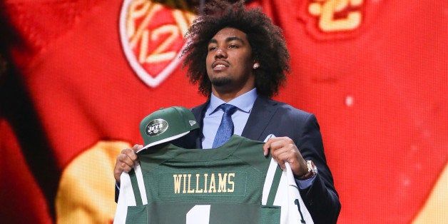 CHICAGO, IL - APRIL 30: Leonard Williams of the USC Trojans holds up a jersey after being chosen #6 overall by the New York