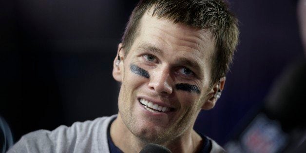 New England Patriots quarterback Tom Brady (12) responds to questions during a news interview after the NFL Super Bowl XLIX f