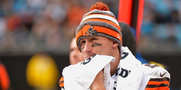 CHARLOTTE, NC - DECEMBER 21: Johnny Manziel #2 of the Cleveland Browns watches from the bench during the second half of a lo
