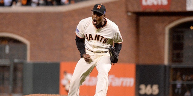 SAN FRANCISCO, CA - OCTOBER 15: Santiago Casilla #46 of the San Francisco Giants reacts after getting the final out in the ninth inning against the St. Louis Cardinals during Game Four of the National League Championship Series at AT&T Park on October 15, 2014 in San Francisco, California. (Photo by Harry How/Getty Images)