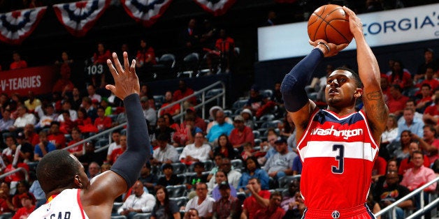 ATLANTA, GA - MAY 05: Bradley Beal #3 of the Washington Wizards attempts a three-point basket against Paul Millsap #4 of the