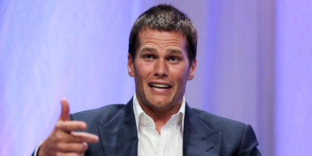 New England Patriots quarterback Tom Brady gestures during an event at Salem State University in Salem, Mass., Thursday, May