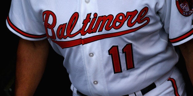 BALTIMORE, MD - MAY 11: Bobby Dickerson #11, third base coach of the Baltimore Orioles, exits the dugout before the game against the Toronto Blue Jays at Oriole Park at Camden Yards on May 11, 2015 in Baltimore, Maryland. The Orioles organization decided to forego their normal uniform jersey for one bearing 'Baltimore' in solidarity with the city that has just recently experienced unrest. (Photo by Maddie Meyer/Getty Images)