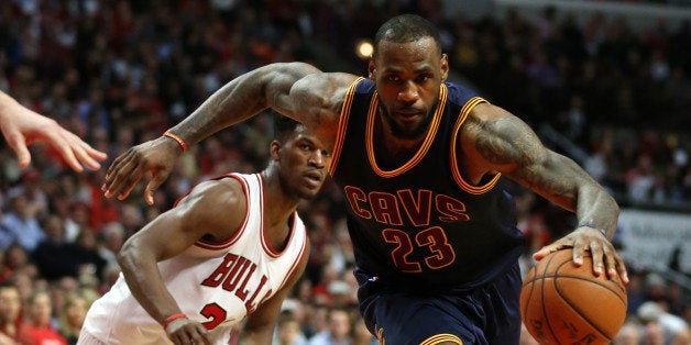 The Cleveland Cavaliers' LeBron James (23) sprints past the Chicago Bulls' Jimmy Butler (21) in Game 6 of the Eastern Confere