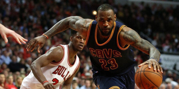 The Cleveland Cavaliers' LeBron James (23) sprints past the Chicago Bulls' Jimmy Butler (21) in Game 6 of the Eastern Conference semifinals at the United Center in Chicago on Thursday, May 14, 2015. The Cavs won, 94-73, to eliminate the Bulls. (Chris Sweda/Chicago Tribune/TNS via Getty Images)