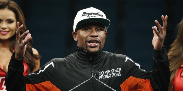 File- This May 2, 2015, file photo shows Floyd Mayweather Jr. gesturing during a press conference following his welterweight title fight in Las Vegas. Mayweather said in an upcoming interview with Showtime that at this moment he's not interested in a rematch with Manny Pacquiao "because he's a sore loser and he's a coward." (AP Photo/John Locher, File)