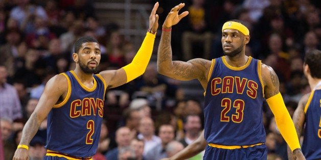 CLEVELAND, OH - FEBRUARY 26: Kyrie Irving #2 and LeBron James #23 of the Cleveland Cavaliers celebrate during the first half against the Golden State Warriors at Quicken Loans Arena on February 26, 2015 in Cleveland, Ohio. NOTE TO USER: User expressly acknowledges and agrees that, by downloading and or using this photograph, User is consenting to the terms and conditions of the Getty Images License Agreement. (Photo by Jason Miller/Getty Images)