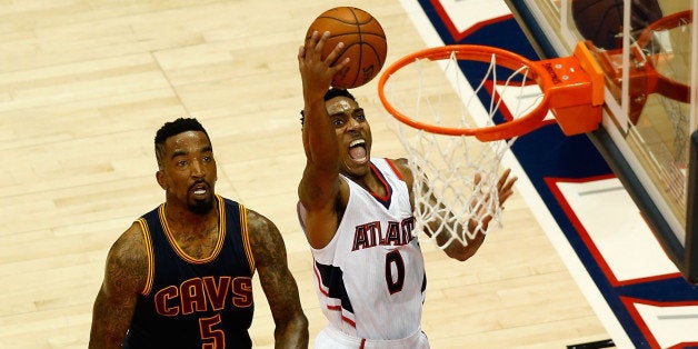 ATLANTA, GA - MAY 20: Guard Jeff Teague #0 of the Atlanta Hawks gets by guard J.R. Smith #5 of the Cleveland Cavaliers for a layup during Game One of the Eastern Conference Finals during the NBA Playoffs at Philips Arena on May 20, 2015 in Atlanta, Georgia. NOTE TO USER: User expressly acknowledges and agrees that, by downloading and or using this photograph, User is consenting to the terms and conditions of the Getty Images License Agreement. (Photo by Mike Zarrilli/Getty Images)