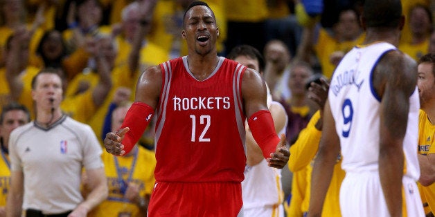 OAKLAND, CA - MAY 27: Dwight Howard #12 of the Houston Rockets reacts in the second half while taking on the Golden State Warriors during game five of the Western Conference Finals of the 2015 NBA Playoffs at ORACLE Arena on May 27, 2015 in Oakland, California. NOTE TO USER: User expressly acknowledges and agrees that, by downloading and or using this photograph, user is consenting to the terms and conditions of Getty Images License Agreement. (Photo by Ezra Shaw/Getty Images)