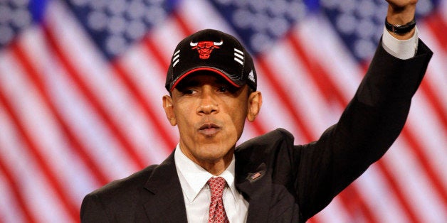 President Barack Obama wear a Chicago Bulls basketball cap as he speaks at a DNC fundraising event at Navy Pier in Chicago, A