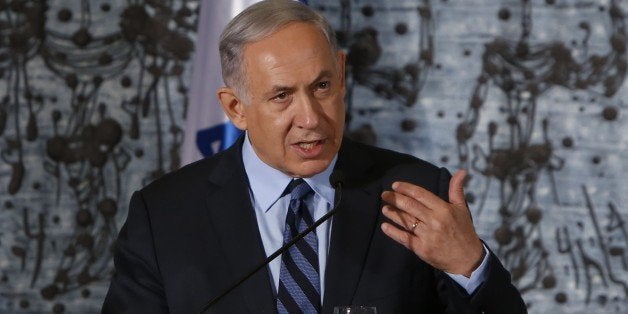 Israeli Prime Minister Benjamin Netanyahu delivers a statement during the traditional photograph in honor of the swearing in of the 34th Government of Israel on May 19, 2015 at the presidential compound in Jerusalem. AFP PHOTO / GALI TIBBON (Photo credit should read GALI TIBBON/AFP/Getty Images)