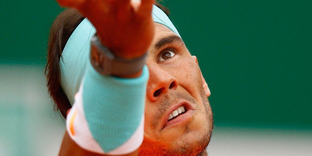 MONTE-CARLO, MONACO - APRIL 16: Rafael Nadal of Spain serves to John Isner of USA during day five of the Monte Carlo Rolex Masters tennis at the Monte-Carlo Sporting Club on April 16, 2015 in Monte-Carlo, Monaco. (Photo by Julian Finney/Getty Images)