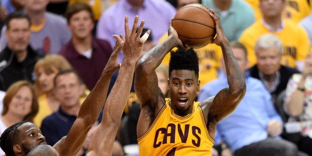 CLEVELAND, OH - MAY 26: Iman Shumpert #4 of the Cleveland Cavaliers looks to pass against DeMarre Carroll #5 and Al Horford #15 of the Atlanta Hawks in the first half during Game Four of the Eastern Conference Finals of the 2015 NBA Playoffs at Quicken Loans Arena on May 26, 2015 in Cleveland, Ohio. NOTE TO USER: User expressly acknowledges and agrees that, by downloading and or using this Photograph, user is consenting to the terms and conditions of the Getty Images License Agreement. (Photo by Jason Miller/Getty Images)