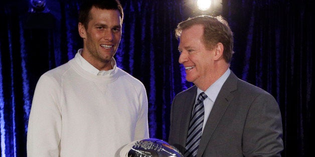 New England Patriots quarterback Tom Brady poses with NFL Commissioner Rodger Goodell during a news conference after the NFL Super Bowl XLIX football game Monday, Feb. 2, 2015, in Phoenix, Ariz. Brady was named the gameâs most valuable player. (AP Photo/David J. Phillip)