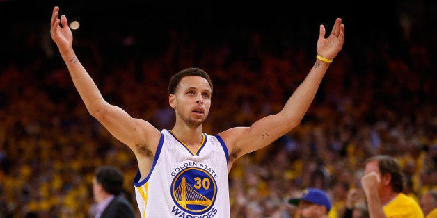 OAKLAND, CA - MAY 27: Stephen Curry #30 of the Golden State Warriors celebrates late in the fourth quarter against the Houston Rockets during game five of the Western Conference Finals of the 2015 NBA Playoffs at ORACLE Arena on May 27, 2015 in Oakland, California. NOTE TO USER: User expressly acknowledges and agrees that, by downloading and or using this photograph, user is consenting to the terms and conditions of Getty Images License Agreement. (Photo by Ezra Shaw/Getty Images)