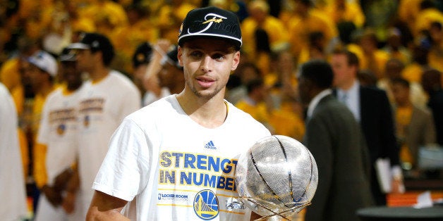 OAKLAND, CA - MAY 27: Stephen Curry #30 of the Golden State Warriors celebrates the Warriors 104-90 victory against the Houston Rockets during game five of the Western Conference Finals of the 2015 NBA Playoffs at ORACLE Arena on May 27, 2015 in Oakland, California. NOTE TO USER: User expressly acknowledges and agrees that, by downloading and or using this photograph, user is consenting to the terms and conditions of Getty Images License Agreement. (Photo by Ezra Shaw/Getty Images)