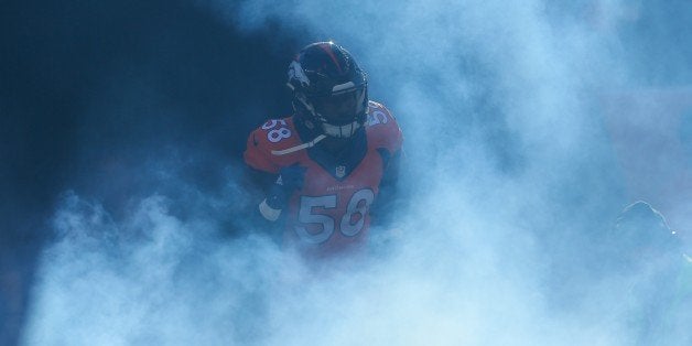 DENVER, CO - DECEMBER 28: Outside linebacker Von Miller #58 of the Denver Broncos emerges from the tunnel during player intr