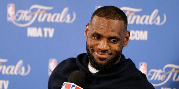 Cleveland Cavaliers forward LeBron James smiles during a news conference after Game 2 of basketball's NBA Finals Sunday, June 7, 2015, in Oakland, Calif. Cleveland won the game in 95-93 in overtime. (AP Photo/Ben Margot)