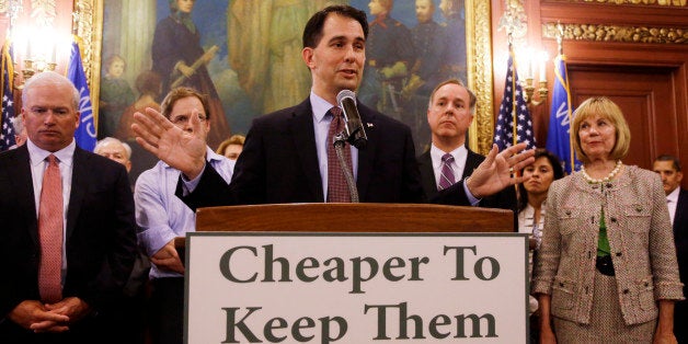 Wisconsin Gov. Scott Walker talks about a deal to pay for a new arena for the Milwaukee Bucks at a news conference Thursday, June 4, 2015, in Madison, Wis. Taxpayers would pick up half the cost of a new $500 million arena for the NBA basketball team under a financial deal that would rely on current and former team owners for the rest, Walker said Thursday. (AP Photo/Morry Gash)