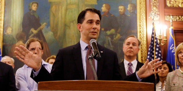 Wisconsin Gov. Scott Walker talks about a deal to pay for a new arena for the Milwaukee Bucks at a news conference Thursday,