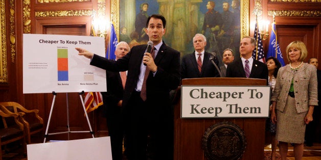 Wisconsin Gov. Scott Walker talks about a deal to pay for a new arena for the Milwaukee Bucks at a news conference Thursday, June 4, 2015, in Madison, Wis. Taxpayers would pick up half the cost of a new $500 million arena for the NBA basketball team under a financial deal that would rely on current and former team owners for the rest, Walker said Thursday. (AP Photo/Morry Gash)