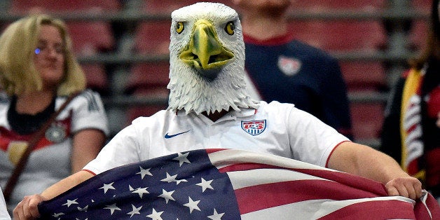 A supporter of the US team wears an American Eagle mask after the soccer friendly match between Germany and the United States in Cologne, western Germany, Wednesday, June 10, 2015. The US team defeated Germany by 2-1. (AP Photo/Martin Meissner)