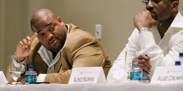 Journalist Jason Whitlock, left tries to get a word in as former NBA all star Alonzo Mourning listens during a panel discussion about the black athlete, held at Morehouse College, Monday May 7, 2007, in Atlanta. Whitlock took heat during much of the discussion for a newspaper column he wrote condemning fellow panelist Vivian Stringer for her reactions to the infamous Don Imus comments. (AP Photo/John Amis)