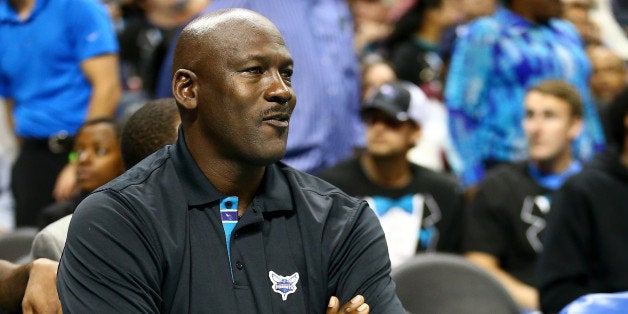 CHARLOTTE, NC - OCTOBER 29: Michael Jordan, owner of the Charlotte Hornets, watches on during their game against the Milwauk