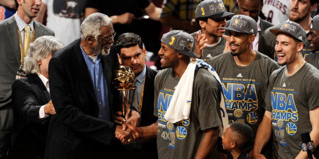 CLEVELAND, OH - JUNE 16: Bill Russell and Andre Iguodala #9 of the Golden State Warriors shake hands after he receives the 2015 NBA Finals MVP award after a win against the Cleveland Cavaliers in Game Six of the 2015 NBA Finals at The Quicken Loans Arena on June 16, 2015 in Cleveland, OH. NOTE TO USER: User expressly acknowledges and agrees that, by downloading and/or using this Photograph, user is consenting to the terms and conditions of the Getty Images License Agreement. Mandatory Copyright Notice: Copyright 2015 NBAE (Photo by David Liam Kyle/NBAE via Getty Images)