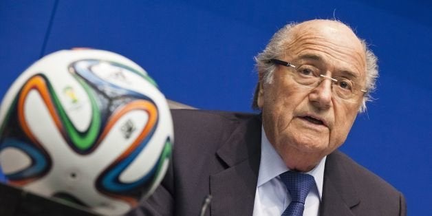 FIFA president Sepp Blatter talks during a press conference following an executive meeting of the football's world governing body at the Home of FIFA on March 21, 2014 in Zurich. A report on migrant workers' rights in Qatar ahead of the 2022 World Cup and the 2014 FIFA World Cup in Brazil was on the agenda. AFP PHOTO / MICHAEL BUHOLZER (Photo credit should read MICHAEL BUHOLZER/AFP/Getty Images)