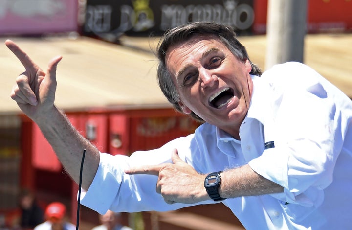 Jair Bolsonaro has made a gun salute the signature of a campaign that promises to fight Brazil's outbreak of violent crime wi