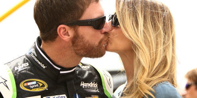 BROOKLYN, MI - JUNE 14: Dale Earnhardt Jr., driver of the #88 AMP ENERGY Chevrolet, kisses his girlfriend Amy Reimann prior to the NASCAR Sprint Cup Series Quicken Loans 400 at Michigan International Speedway on June 14, 2015 in Brooklyn, Michigan. (Photo by Rey Del Rio/Getty Images)