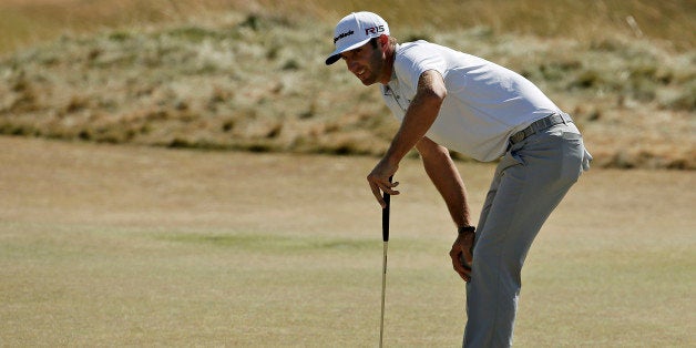 Dustin Johnson reacts to his putt on the sixth hole during the final round of the U.S. Open golf tournament at Chambers Bay o