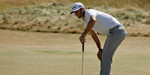 Dustin Johnson reacts to his putt on the sixth hole during the final round of the U.S. Open golf tournament at Chambers Bay on Sunday, June 21, 2015 in University Place, Wash. (AP Photo/Charlie Riedel)