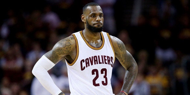 CLEVELAND, OH - JUNE 16: LeBron James #23 of the Cleveland Cavaliers reacts in the fourth quarter against the Golden State Warriors during Game Six of the 2015 NBA Finals at Quicken Loans Arena on June 16, 2015 in Cleveland, Ohio. NOTE TO USER: User expressly acknowledges and agrees that, by downloading and or using this photograph, user is consenting to the terms and conditions of Getty Images License Agreement. (Photo by Ezra Shaw/Getty Images)