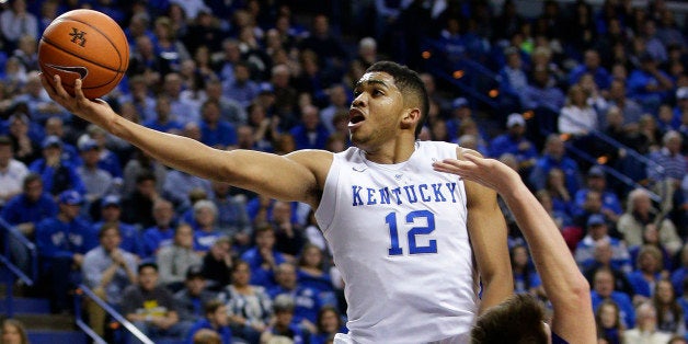 Kentucky's Karl-Anthony Towns (12) shoots next to Grand Canyon's Matt Jackson, right, and during the first half of an NCAA college basketball game, Friday, Nov. 14, 2014, in Lexington, Ky. (AP Photo/James Crisp)